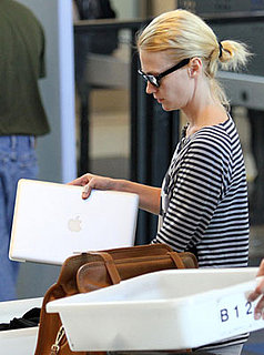 January Jones Carries a MacBook Pro at LAX