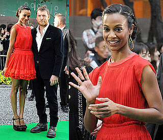 Zoe Saldana Attends Tokyo Film Festival in an Red Orange Ruffle Dress and Black Platforms