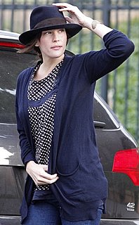 Liv Tyler Wears Navy Cardigan and Hat in WIndy New York City