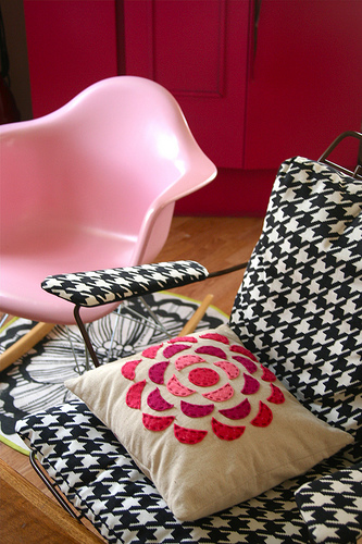 A bubble gum pink rocker is muted by the masculine houndstooth pattern on the chair next to it.
Source
A bubble gum pink rocker is muted by the masculine houndstooth pattern on the chair next to it.
Source