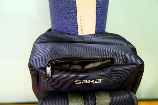Top of backpack, showing zippered compartment Top of backpack, showing zippered compartment