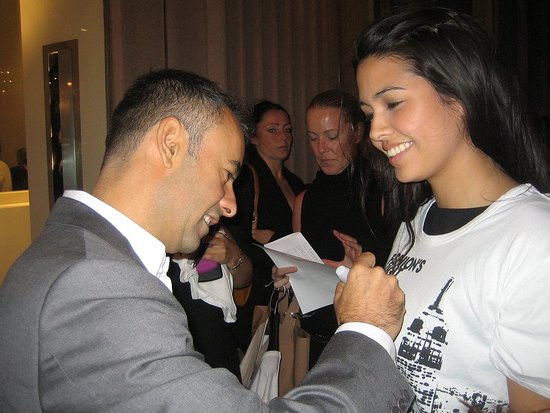 Francisco Costa signing a Fashion's Night Out tee shirt in front of his Calvin Klein store
Francisco Costa signing a Fashion's Night Out tee shirt in front of his Calvin Klein store