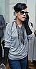 Singer Lily Allen Attends the Form Launch Party in London Wearing Black Ruched Gloves