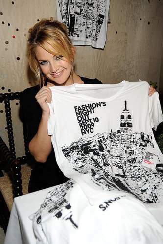 Kate shows off the event's tee Kate shows off the event's tee