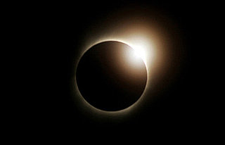 Front Page: Solar Eclipse Brings Darkness at Dawn 