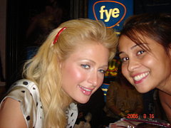 Celebrity Sighting: Paris Poses With A Fan