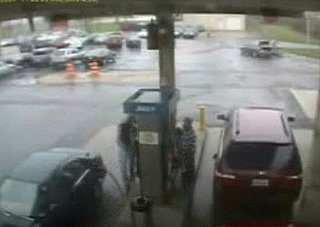 Man Pushes Red Button at Gas Station