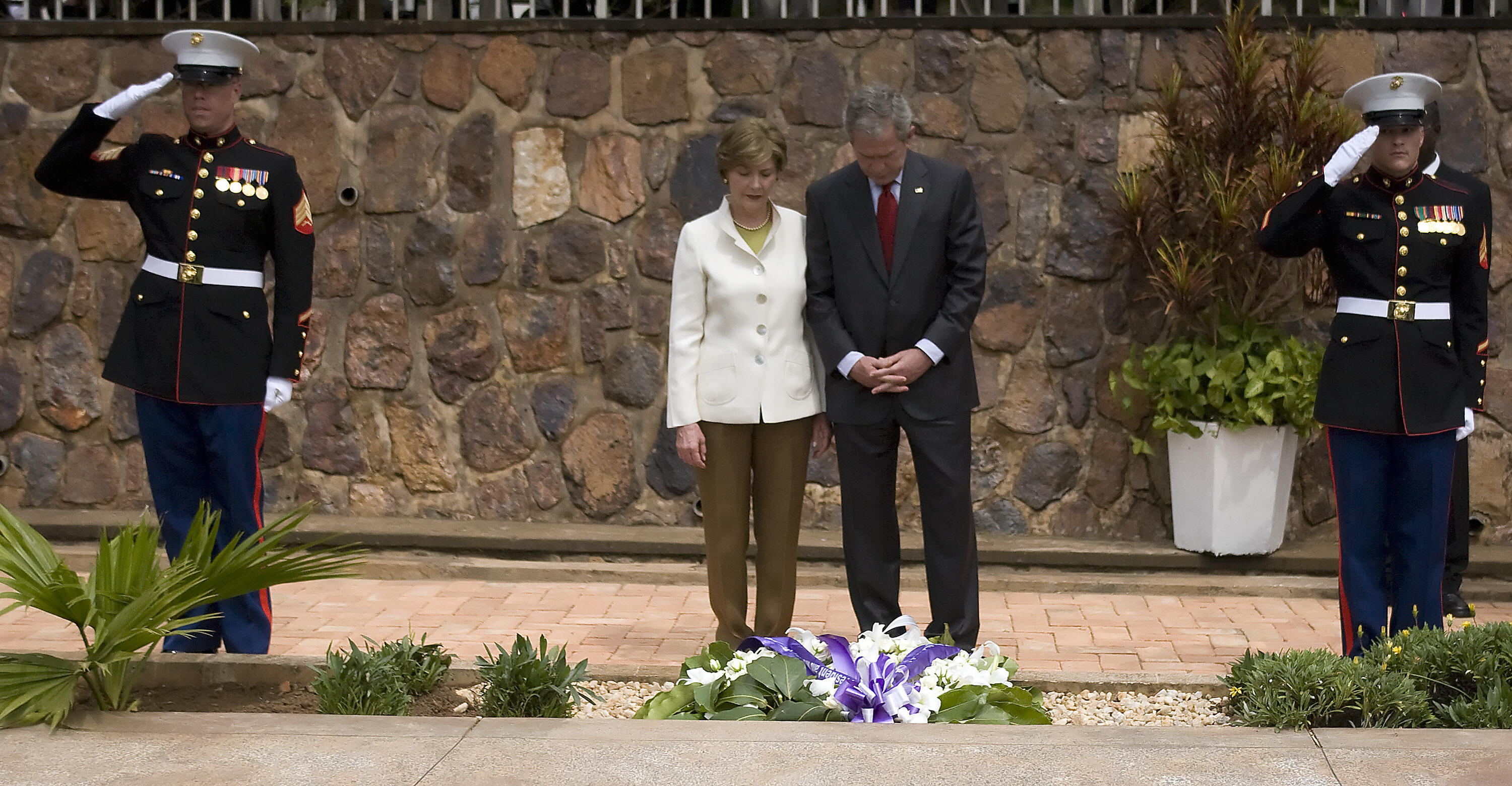 Mr. and Mrs. Bush lay a wreath at a Rwanda genocide memorial. Mr. and Mrs. Bush lay a wreath at a Rwanda genocide memorial.