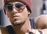 Enrique Iglesias lets reporter kiss him