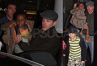 Photos of Guy Ritchie, Rocco Ritchie, and David Banda at London Gatwick Airport