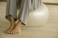 5 Ways to Make Crunches on the Ball More Challenging 5 Ways to Make Crunches on the Ball More Challenging