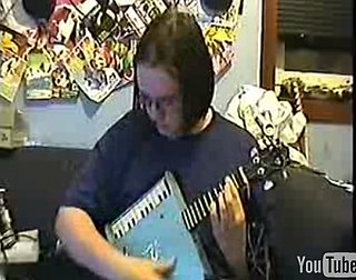 Guy Plays "Final Countdown" on Kazoo and Ukulele Instrument