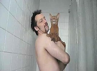 Man Takes His Cat in the Shower