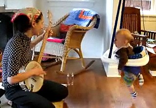 Baby Bounces While Mom Plays the Banjo