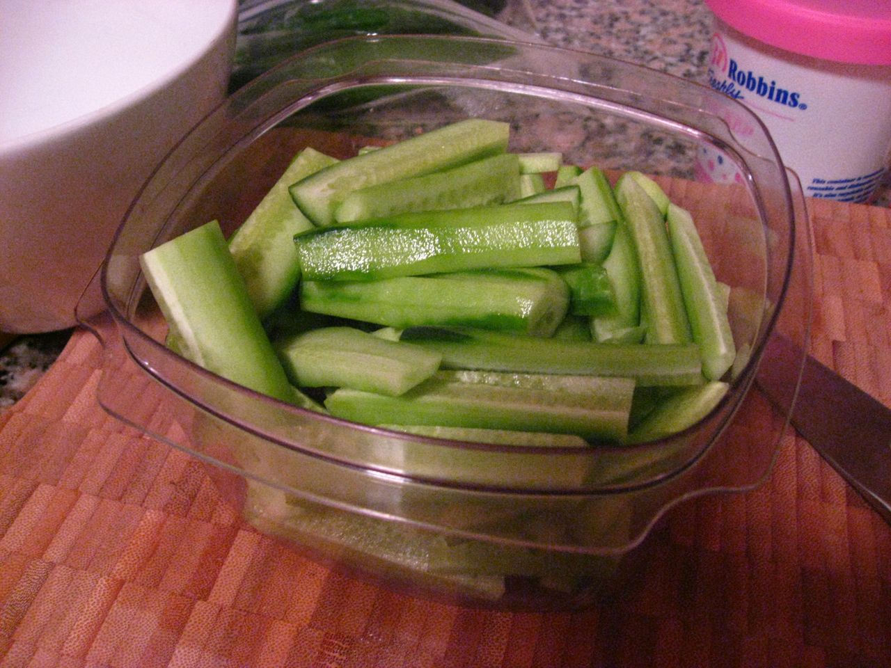 Peeled cucumbers cut into smaller pieces Peeled cucumbers cut into smaller pieces
