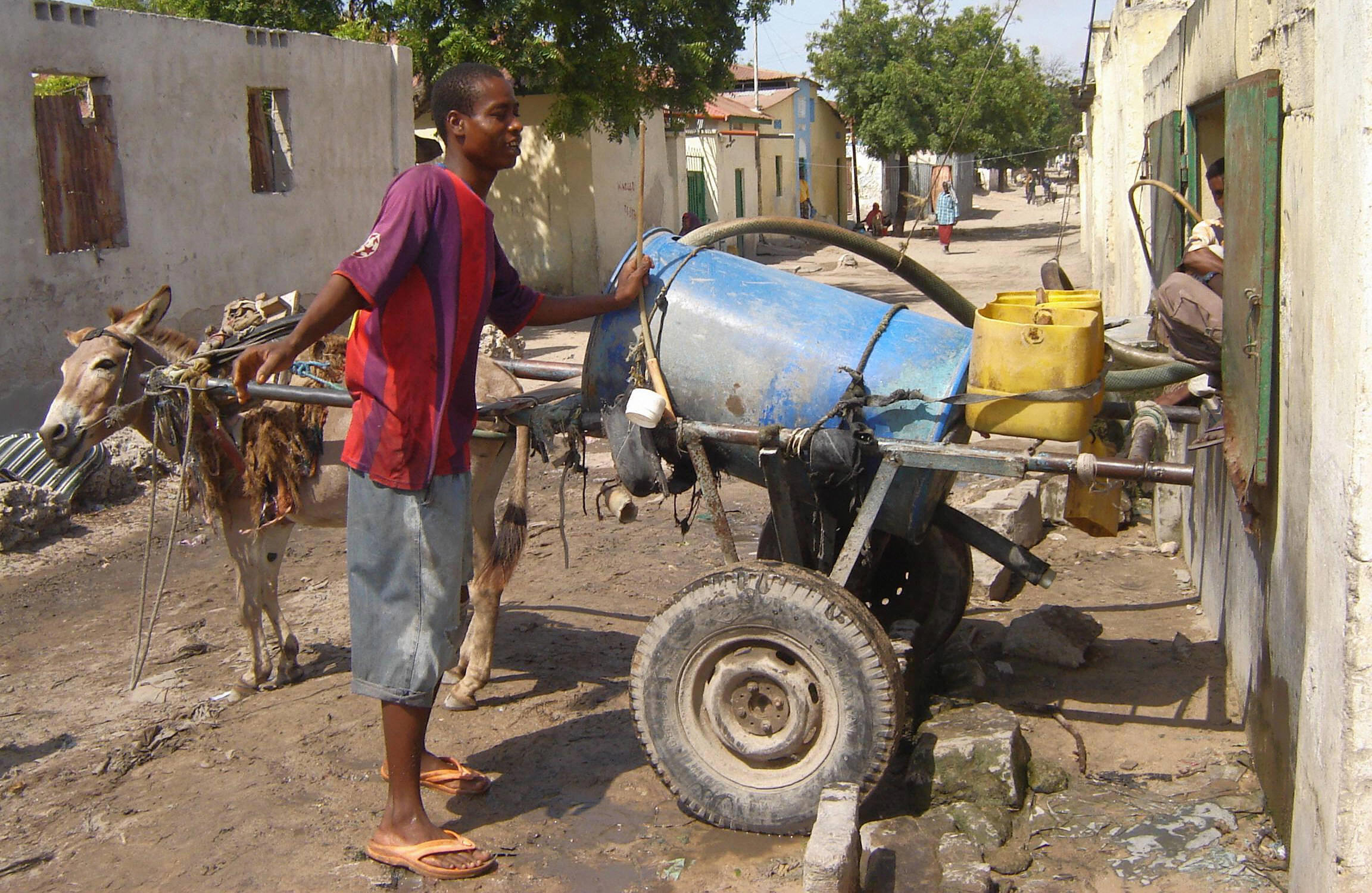 A boy sells water door-to-door in Somalia, tied for most corrupt. Pirates often seize aid shipments to the country. A boy sells water door-to-door in Somalia, tied for most corrupt. Pirates often seize aid shipments to the country.