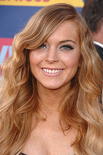 Photo of Lindsay Lohan Says I Love You to Samantha Ronson with Matching Star and Heart Tattoos. Cover of US Marie Claire.