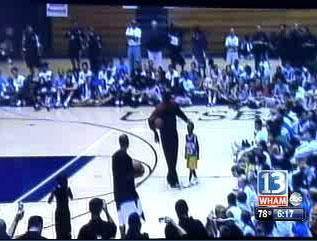 Child Plays Basketball With Michael Jordan