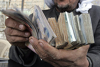 More Money, Less Problems? Iraqi Officials Hand Out Cash