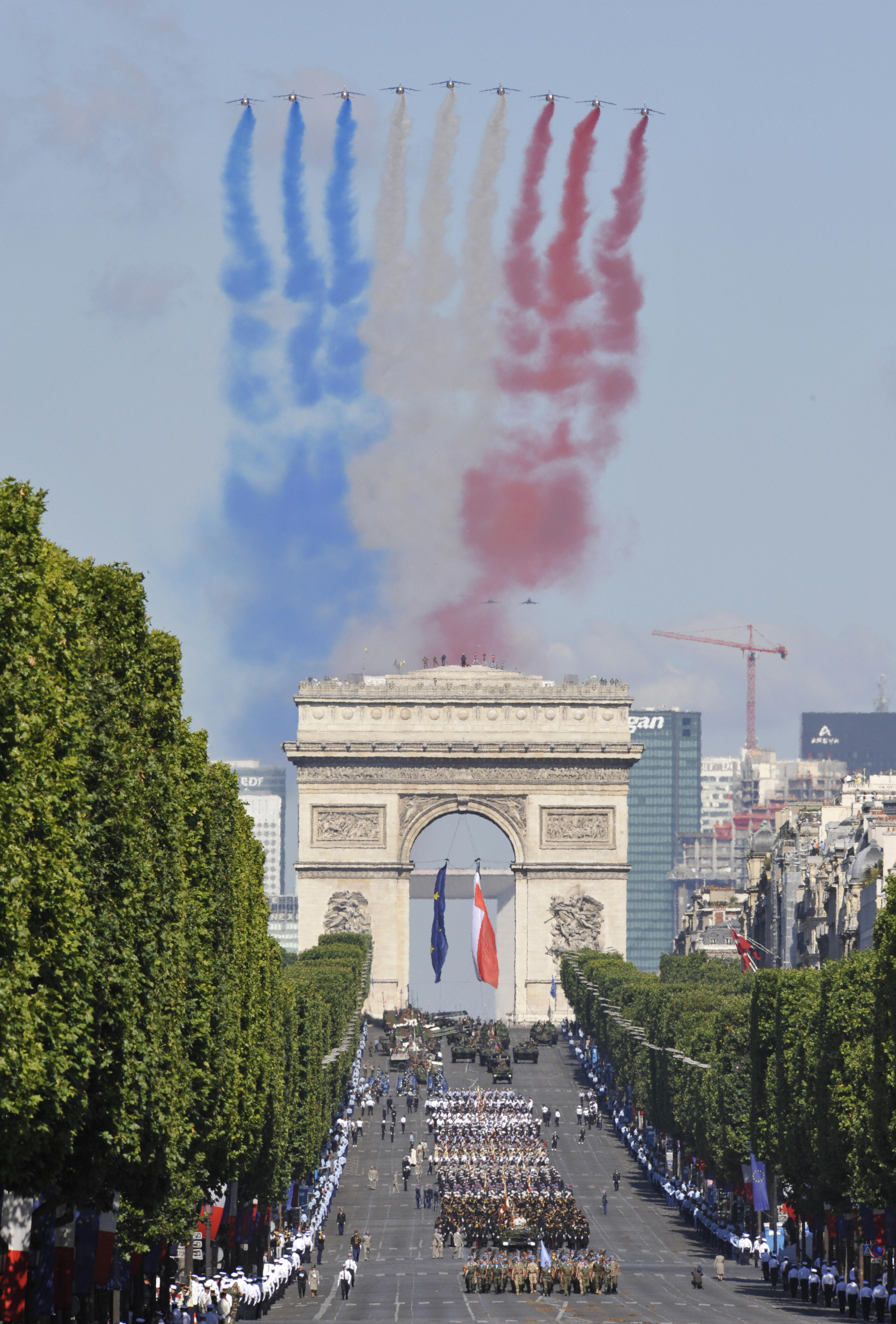 French air force Alpha Jets fly over the Arc de Triomphe. French air force Alpha Jets fly over the Arc de Triomphe.