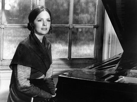 Wearing a bun in <b>Love and Death</b>, 1975.<br />
<span style='font-size:10px !important;'>Photo courtesy of <a href="http:/... Wearing a bun in <b>Love and Death</b>, 1975.<br />
<span style='font-size:10px !important;'>Photo courtesy of <a href="http:/...