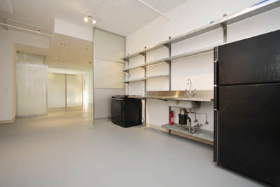 As you can see, it was a drab kitchen with a basic electric stove, painted white and with cold galvanized steel shelves.