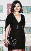 Photo of Ginnifer Goodwin in New York City in a LBD Holding a Black Stella McCartney Grommet Clutch
