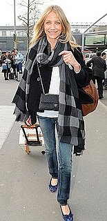Cameron Diaz Arrives at Heathrow Airport in a Burberry Plaid Wrap, Chanel Bag, and Lanvin Leopard Flats