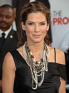 Photo of Sandra Bullock Wearing Alexander McQueen Black Dress and Chunky Necklace at Los Angeles premiere of The Proposal