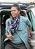Michelle Obama Wearing a Mouthwash Green Rick Owens Jacket and Purple Watch in Paris