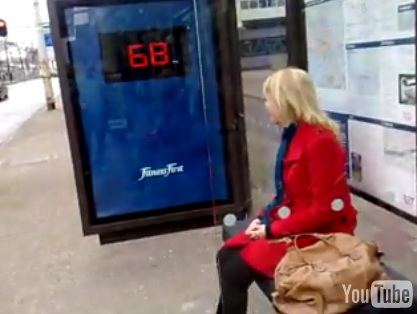 Fitness First Advertisement at Bus Stop Includes a Scale