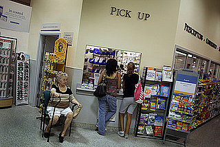 Customers Talk on Their Cell Phones While Getting Prescriptions Filled
