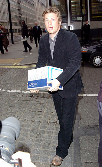 Jamie uses his celebrity power to effect social change. Here, the chef petitions healthier meals for schools at a March 2005 meeting at London's Conservative Campaign headquarters.
Jamie uses his celebrity power to effect social change. Here, the chef petitions healthier meals for schools at a March 2005 meeting at London's Conservative Campaign headquarters.