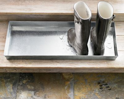 A more industrial tray like this Mudroom Boot Tray ($49) will intercept wet, muddy footwear and keep the mess of the outdoors contained.
A more industrial tray like this Mudroom Boot Tray ($49) will intercept wet, muddy footwear and keep the mess of the outdoors contained.