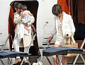 Suri Keeps Her Parental Units In Line, Uniform