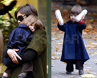 Suri Shows off Fancy Hairdo, Jacket and Bottles