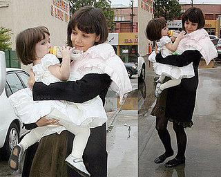 Suri Helps Katie Get in the Spirit