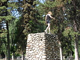Climbin a fire pit rock thing.