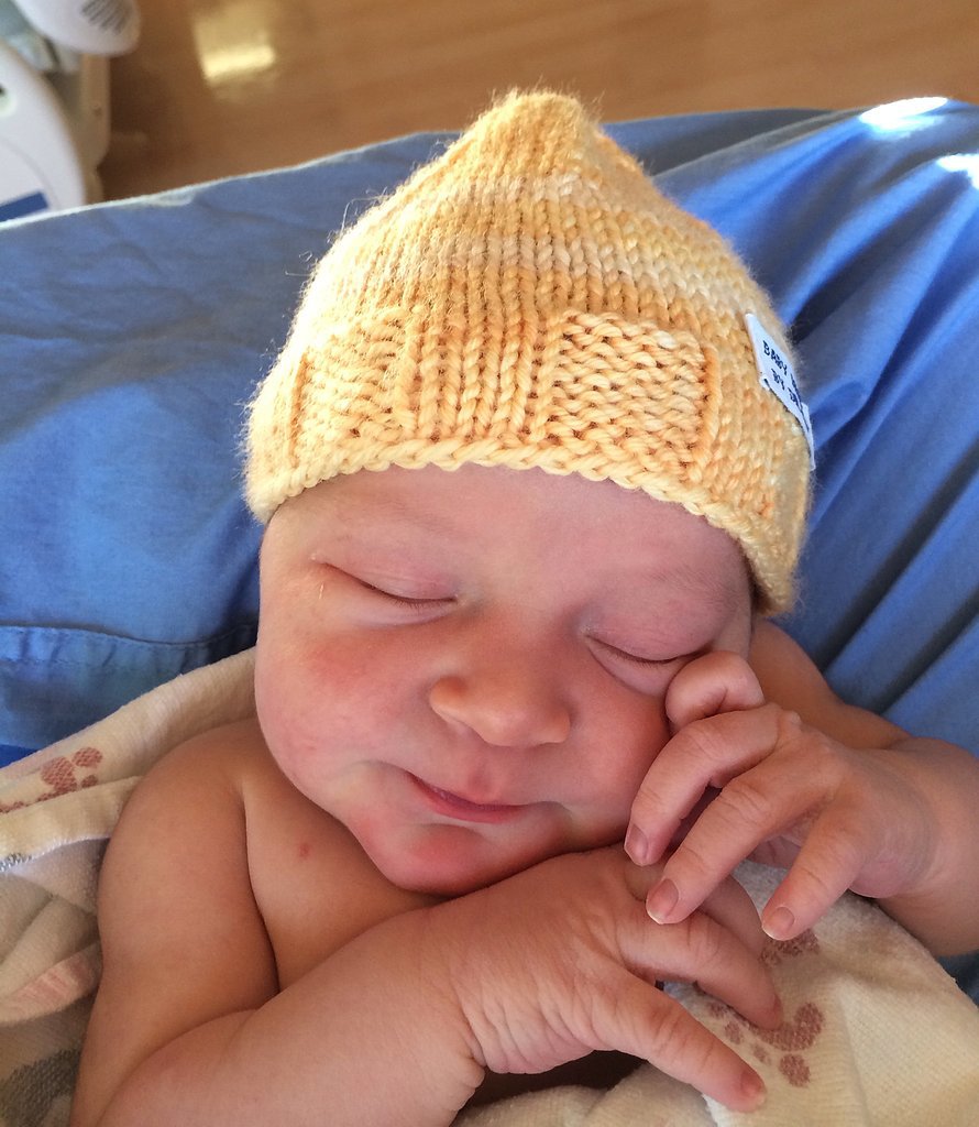 "I started by knitting a small hat in hopes of practicing before trying to knit a larger hat," Sansonetti says. "It turned out pretty well, and by chance was the perfect size for a newborn." The doctor decided to give the practice cap to the next baby he delivered. He recalls the look of surprise and delight on the mother's face, which he says prompted him to knit more miniature hats. 
Source: Dr. Robert Sansonetti
